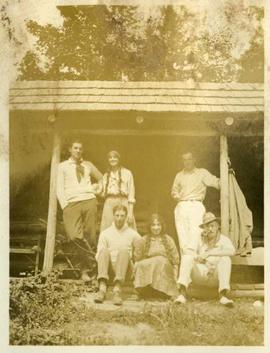 four men, two women at cabin