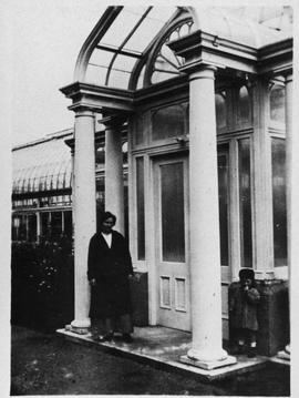 Minnie Hayward and daughter in front of conservatory entrance