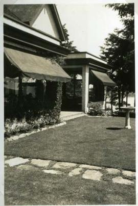 Journey's End, terrace, lawn and birdbath