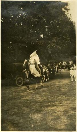 costumed woman on a horse for a fete at government house