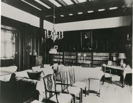 castle library showing east wall with bookshelves and portrait painting