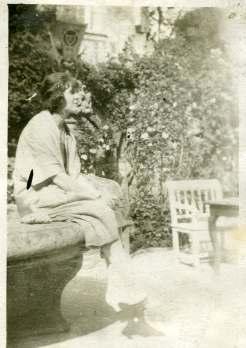 Eileen Molyneux on a stone bench