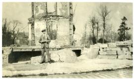 Edward Molyneux by the ruins of his old headquarters, Amentieres, France