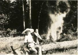 Muriel burning a tree stump