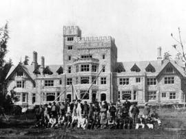 Hatley Castle from the south, construction workers gathered in foreground