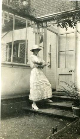 woman straddling a doorstep