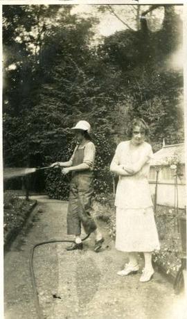 woman watering a garden, with Muriel