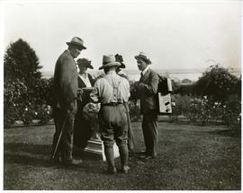 Tadashi Noda (back to camera) leading a conversation in the rose garden