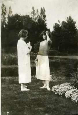 Muriel and Eileen chatting by a pond