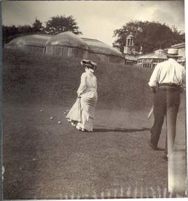 Laura Dunsmuir and a man playing croquet