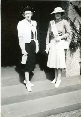 Muriel and friend on steps of Journey's End with Salvation Army sashes