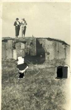 Dola(?) and Muriel on top of a destroyed British tank, exact mark unknown