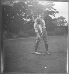 man playing croquet