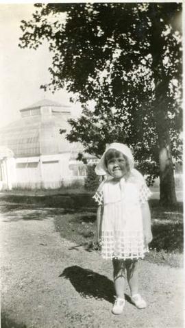 Joan Humphreys in front of conservatory, Hatley Park