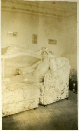 woman reclining indoors