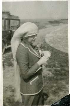 Muriel Dunsmuir in a suit with veil