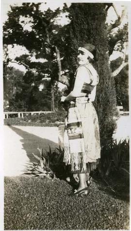 Anne standing, dressed as a flapper