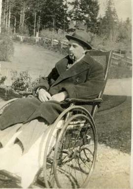 Selden Humphreys in a wheelchair near Neptune Steps, Hatley Park