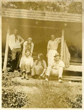 four men, two women at cabin