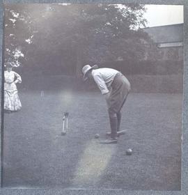 Laura Dunsmuir and a man playing croquet