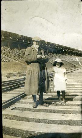 James Dunsmuir and young Dola on a railway track