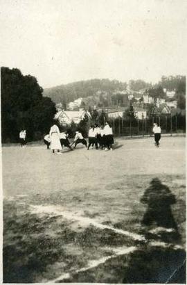 School girls paying field hockey at Miss Ransom and Miss Bridges’ School in Piedmont, California