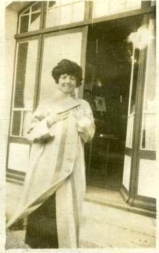 stylish woman in a doorway