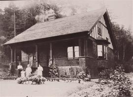 Hayward family outside cottage at Hatley Park