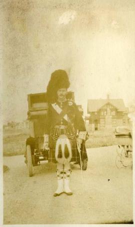 Scottish Canadian uniformed officer in full dress, including feather bonnet